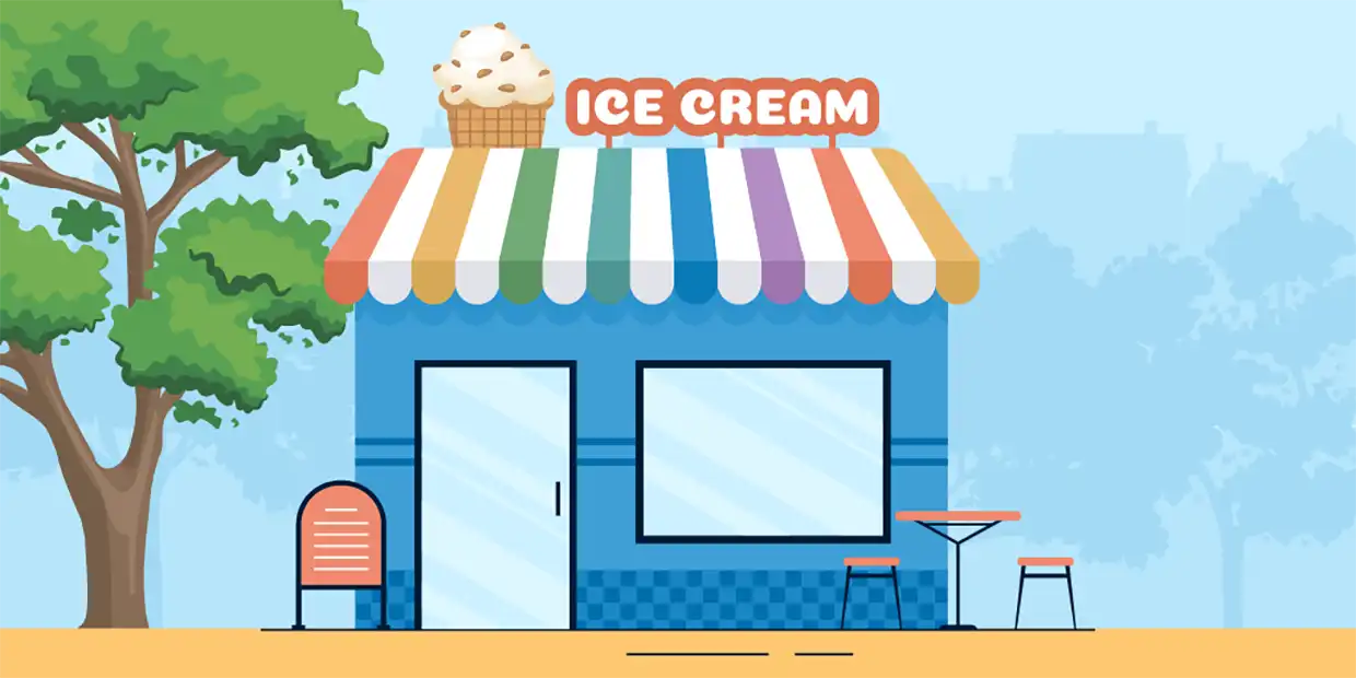 The exterior of an ice cream shop with a menu outside and patio seating