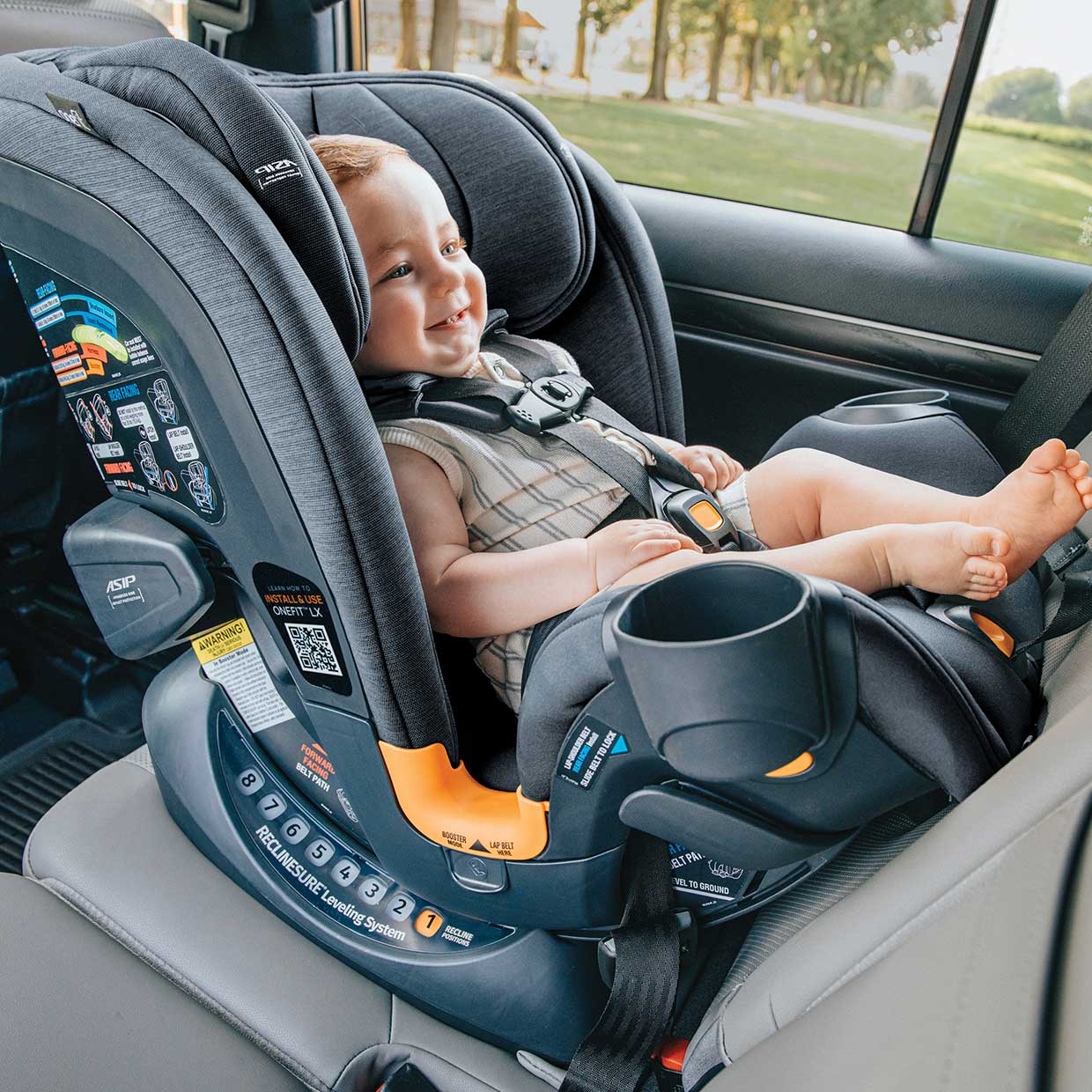 Baby in a Chicco OneFit LX ClearTex All-in-One Car Seat with side imact protection in rear-facing mode