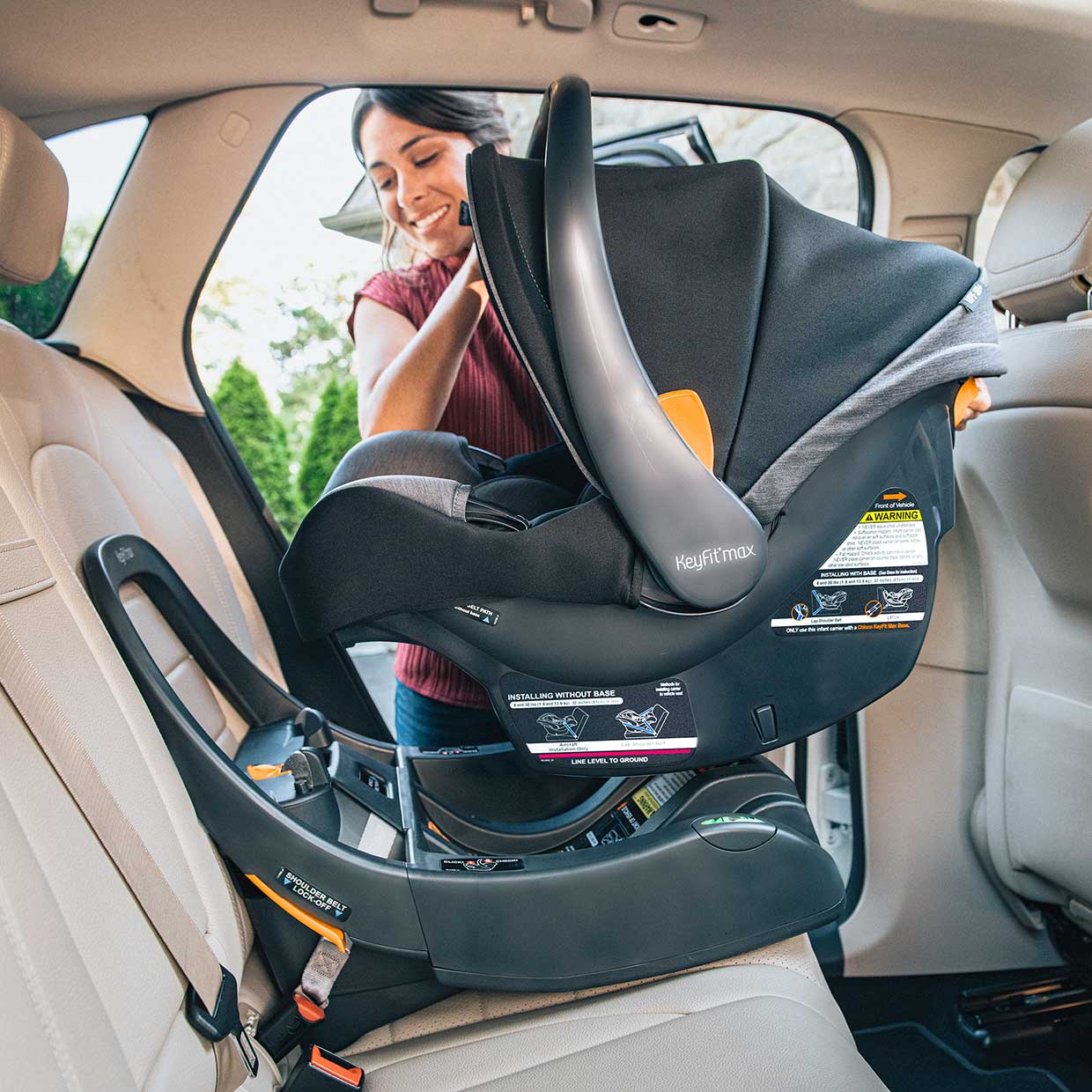 Chicco KeyFit Max car seat being installed in vehicle image