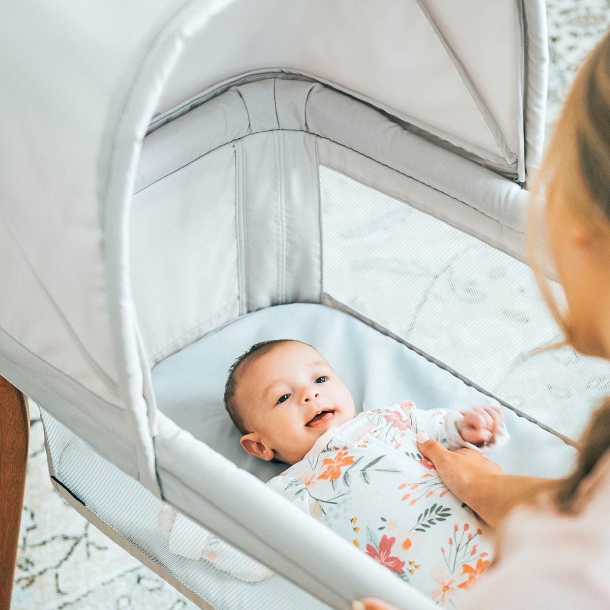 Chicco LullaGo Anywhere Bassinet with baby image