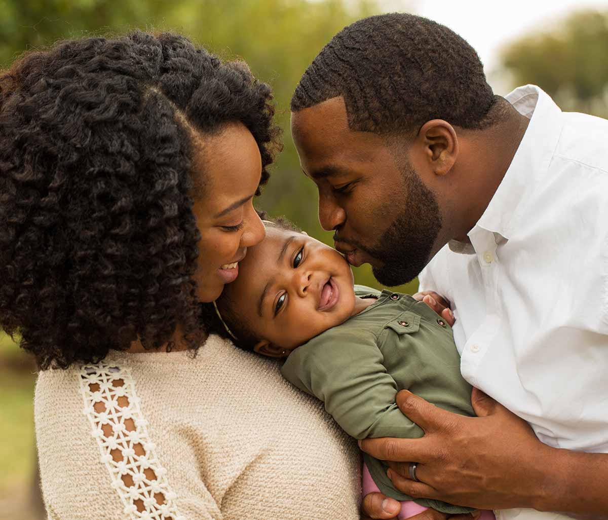 Family with laughing baby