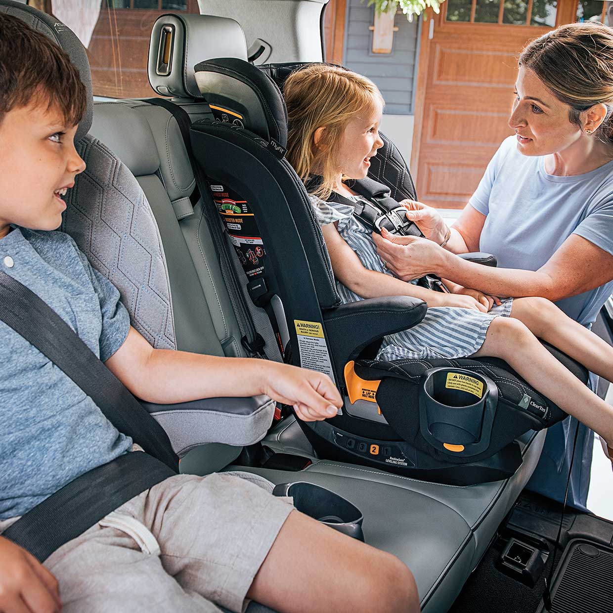 Top tether being installed properly on a Chicco OneFit LX All-in-One Car Seat image