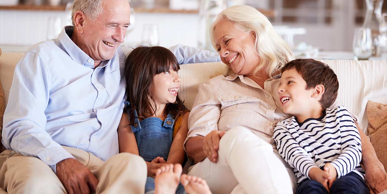 Grandparents with grandchildren on sofa image
