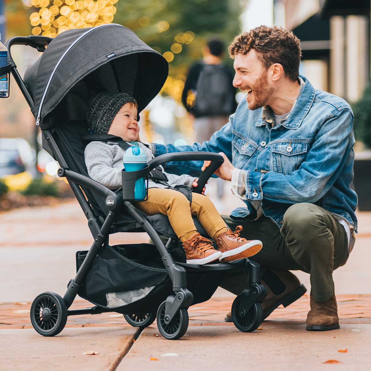 Dad with child in Chicco Presto stroller image