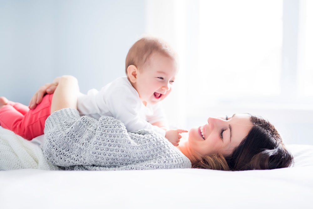 Baby and Mother laughing
