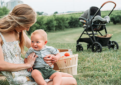 Mom and baby with Chicco KeyFit 35 and Bravo Stroller Travel System