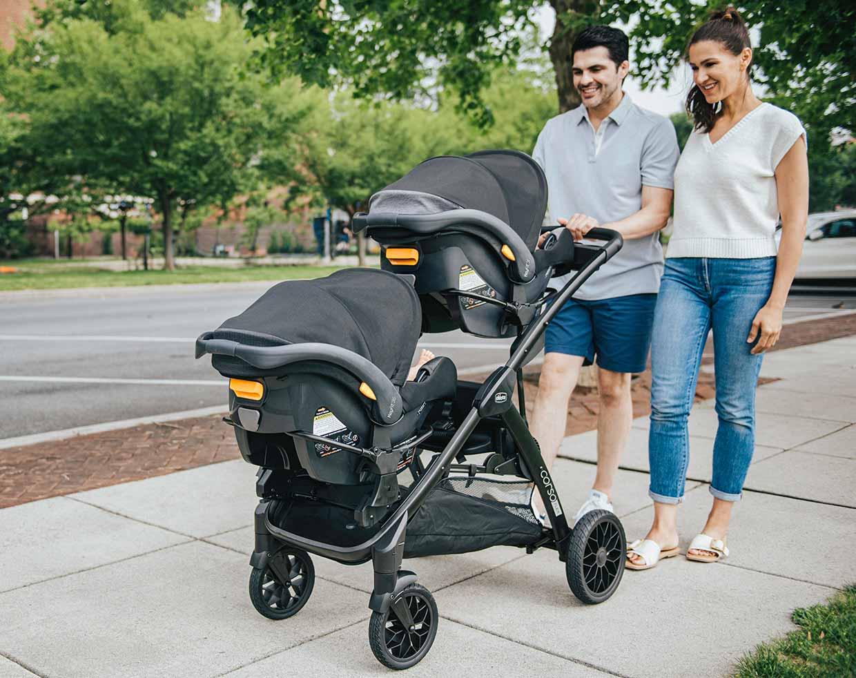Parents pushing twins in Chicco Corso Flex Stroller image