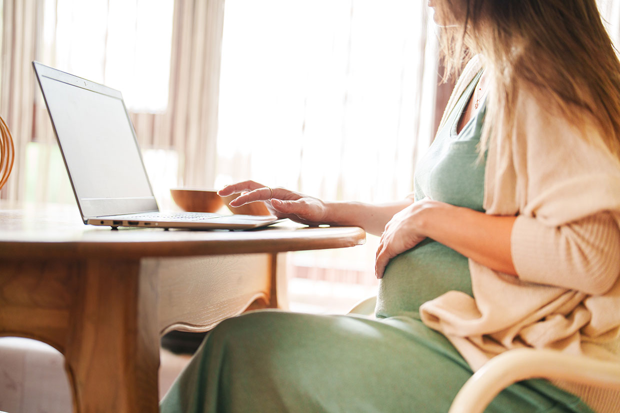 Pregnant Mother using laptop image