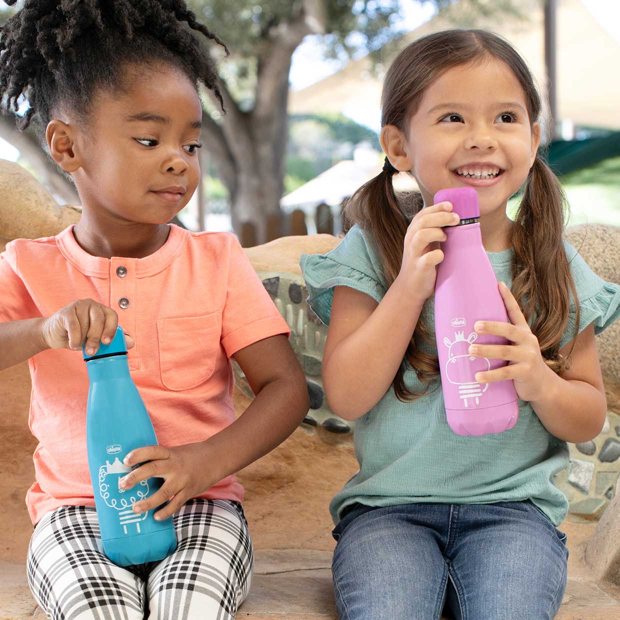 Two children with Chicco Stainless Steel Water Bottles
