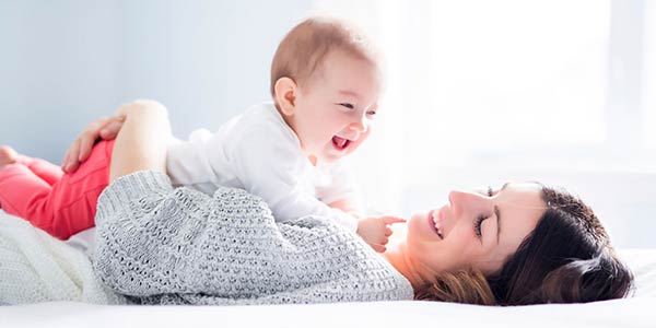 Baby and Mother laughing