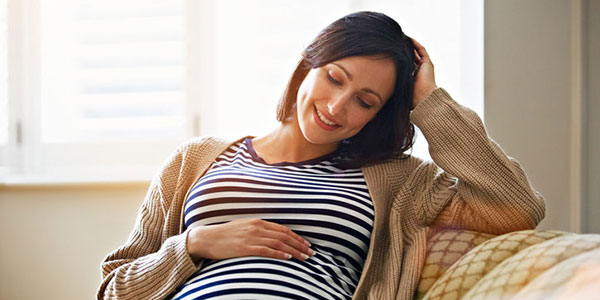 Happy Pregnant Mom baby registering